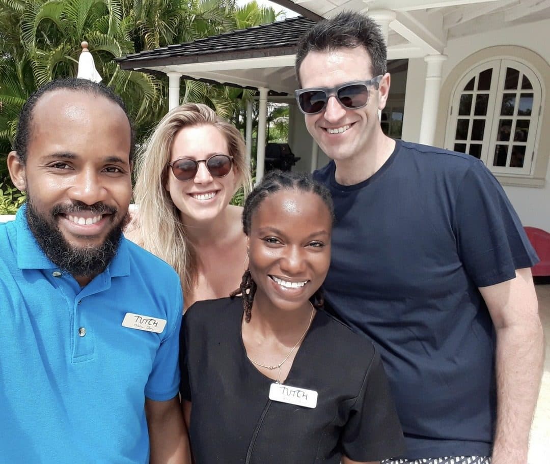 Team with a couple in a garden, mobile spa in Barbados